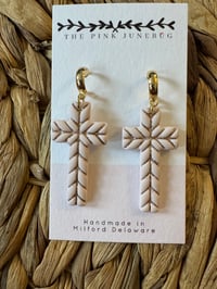 Tan cross 