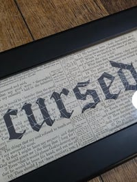 Image 1 of  "CURSED" 1800's bible page with preserved spider web  