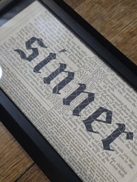 Image 1 of "SINNER" 1800's bible page with preserved spider web  