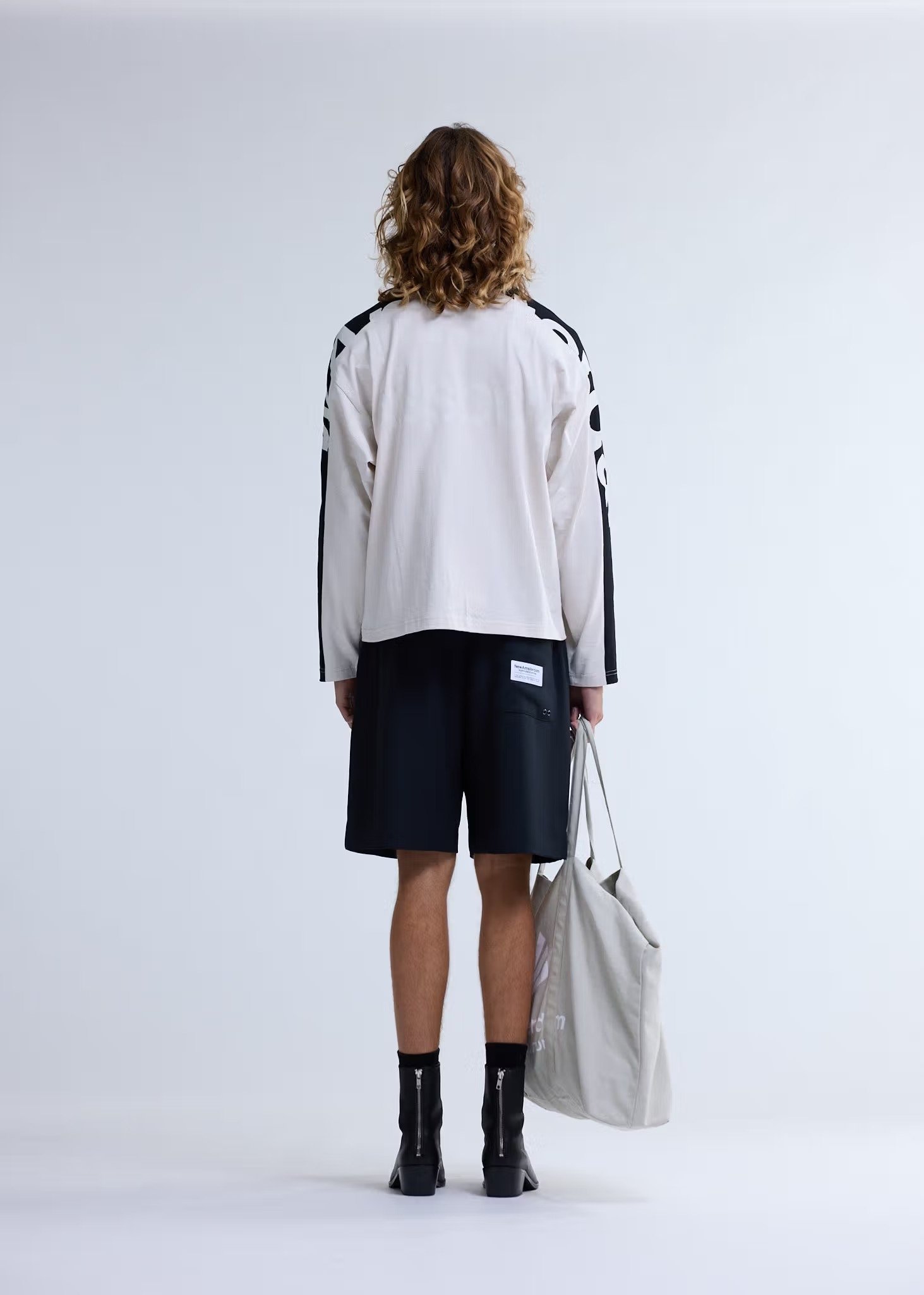 Image of NEW AMSTERDAM SURF ASSOCIATION NAME LONGSLEEVE WARM SAND/BLACK