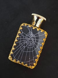 Image 1 of RARE VINTAGE ornate perfume bottle with preserved web 