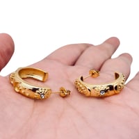 Image 3 of Embossed Star Moon Sun 18K Gold Plated Hoop Earrings