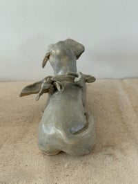 Image 3 of Winged Creatures: Green dog at rest