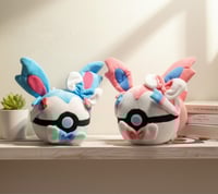 Image 1 of Sylveon Poké Ball Plush Set