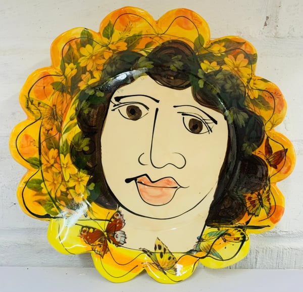 Image of Small yellow and orange frilly plate