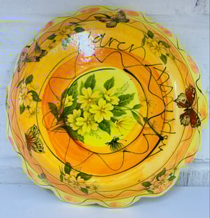 Image of Small yellow and orange frilly plate