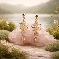 GOLD FLOWER WITH BRONZE COLORED BEAD DANGEL