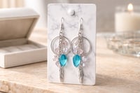 SILVER SUNCATCHER WITH BLUE AND IRIDESCENT TEARDROP DANGLES