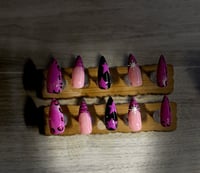 Image 1 of MEDIUM LENGTH STILETTO PINK & BLACK ANIMAL PRINT & STAR ACRYLIC NAILS
