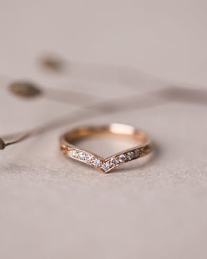 Image of 18ct rose gold white diamond set wishbone semi-eternity ring