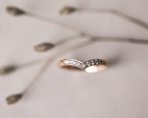 Image of 18ct rose gold white diamond set wishbone semi-eternity ring
