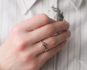 Image of 18ct rose gold white diamond set wishbone semi-eternity ring