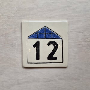 Image of La maison au numéro - plaque de maison