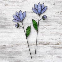 Blue stained glass flower with bud