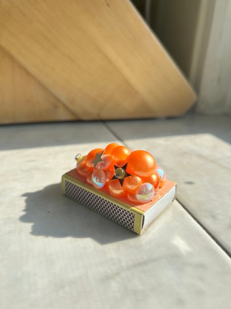 Image of matchbox - orange blobby