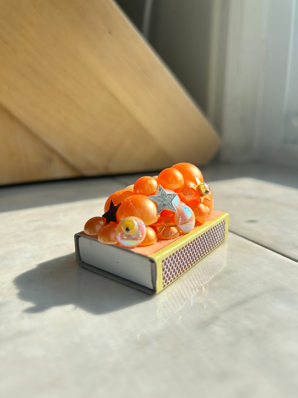 Image of matchbox - orange blobby