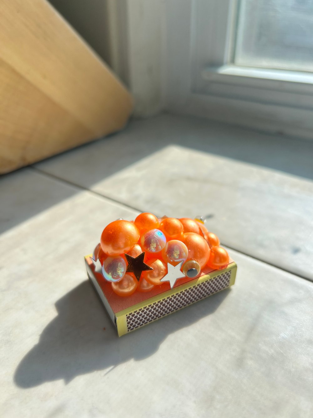 Image of matchbox - orange blobby