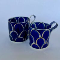 Image 1 of Blue and gold cups and jug