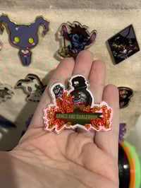 Image 3 of Armed & Dangerous Pin