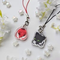 Image 2 of tikki and plagg ❄️ epoxy phone charm