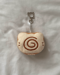 Image 7 of swirl kitty bread plushie keychain