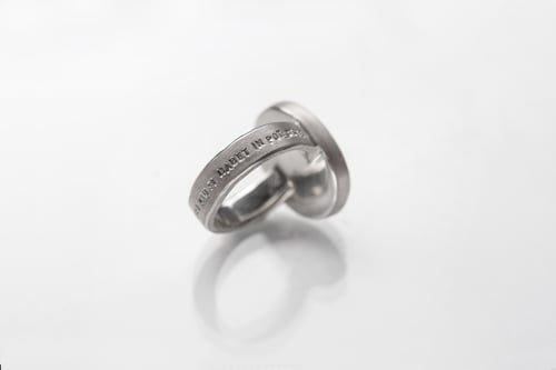 Image of "Is the most.." teddy-bear’s silver ring with photo and rock crystal  · POTENTISSIMUM.. ·