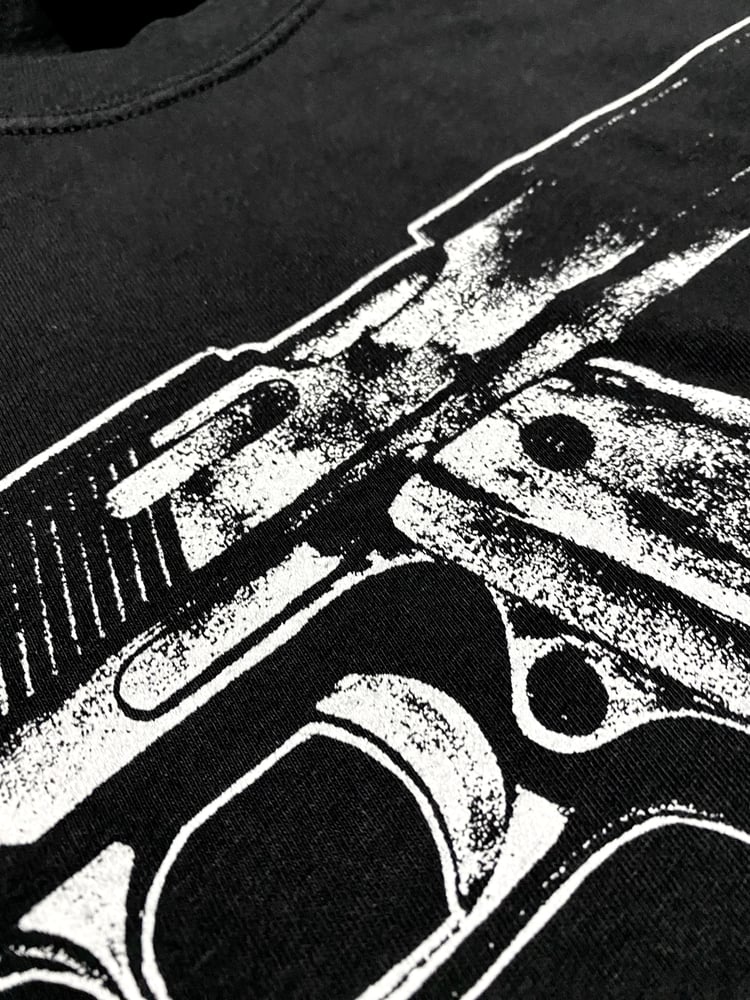 Image of pistol tee
