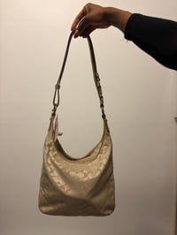 Image 2 of 2012 Coach monogram hobo shoulder bag with a beige and gold floral appliqué design