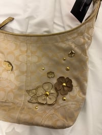 Image 8 of 2012 Coach monogram hobo shoulder bag with a beige and gold floral appliqué design