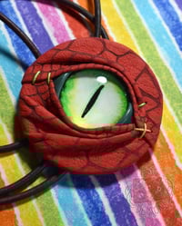 Image 1 of Red Scaly Eye Bolo Tie