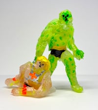 Image 1 of Mossman Dragging He-Man’s Sorry Ass
