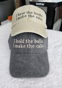 Image 1 of "I have the boobs" and "I hold the balls" Cap Matching sSet