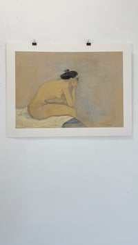 Image 1 of Sitting on the edge of the bed