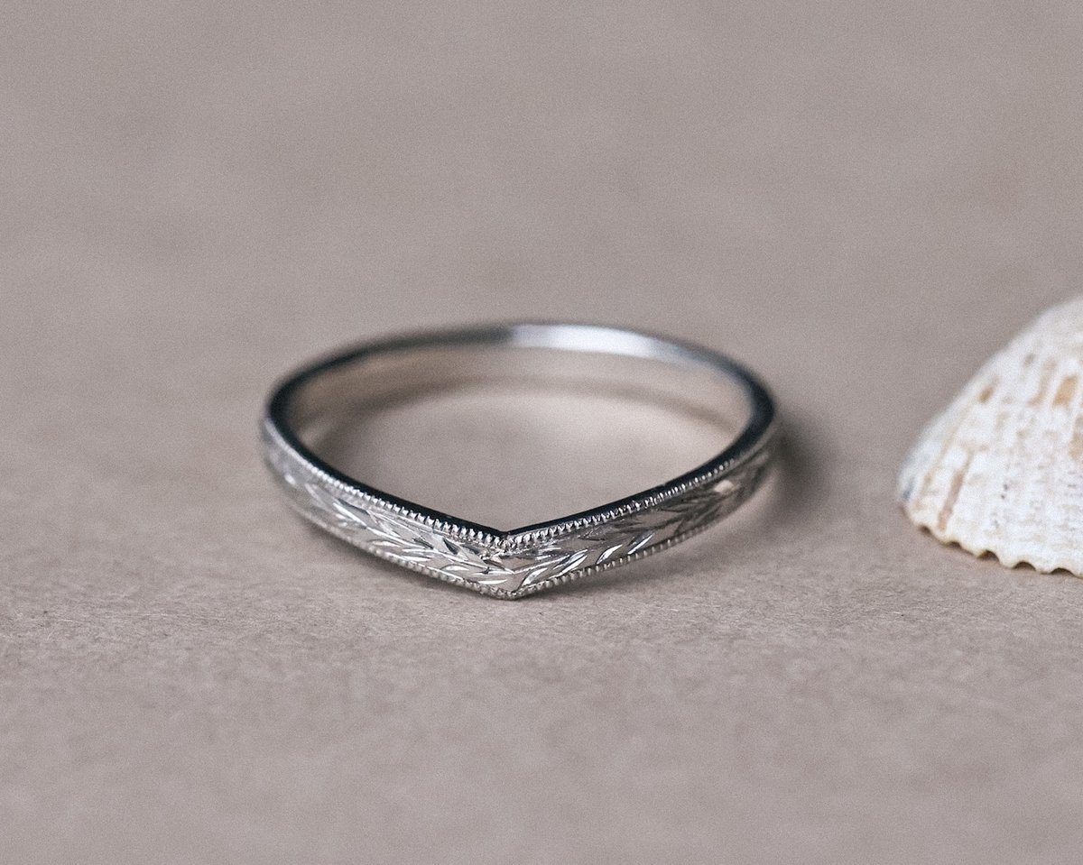 Image of Platinum 2mm flat court ‘Olive leaf’ and milled edge engraved wishbone ring