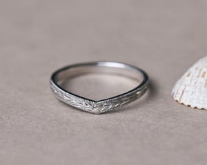 Image of Platinum 2mm flat court ‘Olive leaf’ and milled edge engraved wishbone ring
