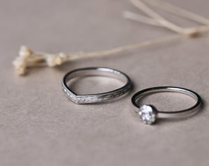 Image of Platinum 2mm flat court ‘Olive leaf’ and milled edge engraved wishbone ring