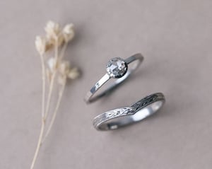 Image of Platinum 2mm flat court ‘Olive leaf’ and milled edge engraved wishbone ring