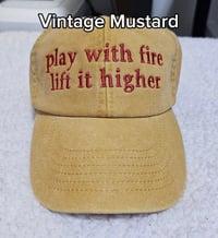 Image 1 of Play with fire lift it higher CAP