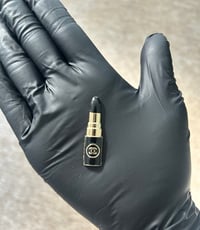 1x C.c Gold/black lipstick style metal flat back charm