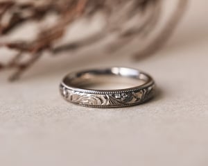 Image of 18ct White gold, 4mm Floral and milled edge engraved ring