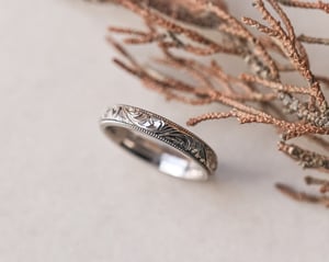 Image of 18ct White gold, 4mm Floral and milled edge engraved ring