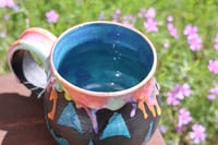 Image 2 of 14 Oz Teal and Rainbow Jack-O-Lantern Mug