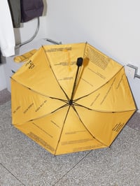 Image 2 of kova&Stasis Space&Lucas Blalock_ Break an Umbrella yellow text