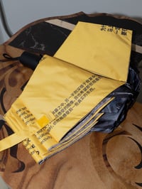 Image 4 of kova&Stasis Space&Lucas Blalock_ Break an Umbrella yellow text