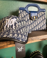 Image 1 of CD Clutch bag & Hat. 