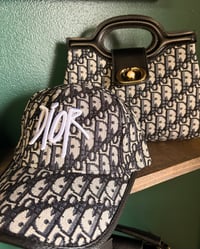 Image 2 of CD Clutch bag & Hat. 