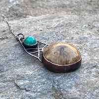 Image 1 of What Remains | Sand  dollar fossil pendant