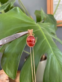Image 1 of Gold Banded Carnelian Oval Crystal Necklace