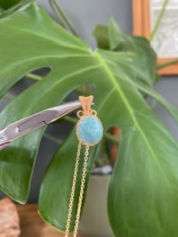 Image 1 of Gold Larimar Oval Coin Crystal Necklace