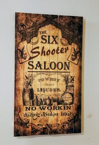 Six Shooter Saloon Sign